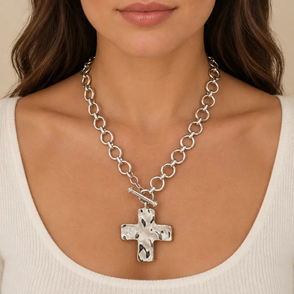 Silver Eternal Cross Necklace with a cream knit top